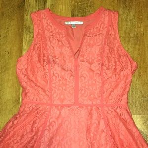 A peachy/pink dress.